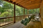 Lower deck with wooden patio swing